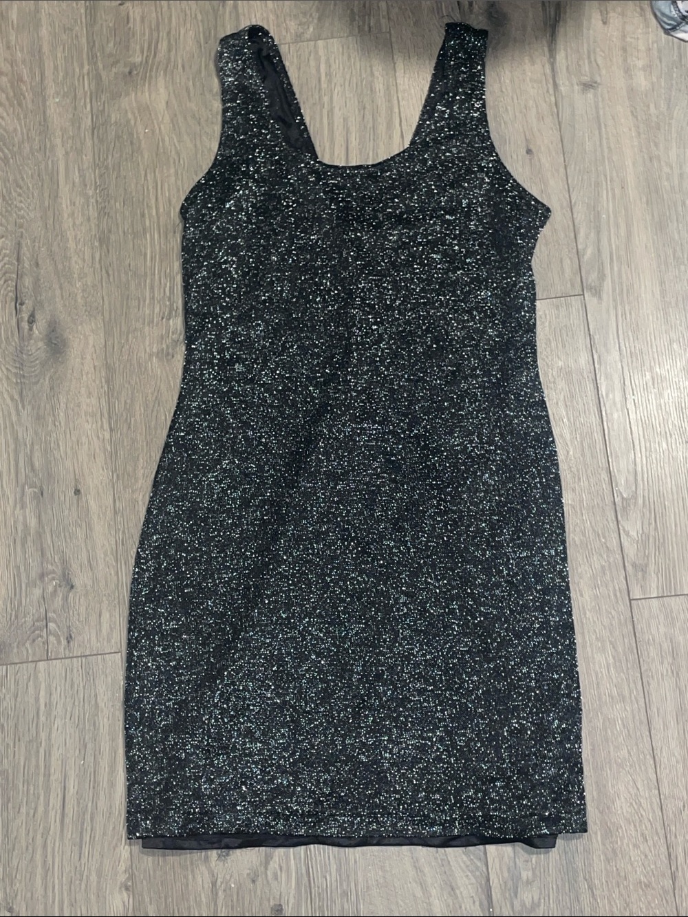 Never worn! Women’s sparkling black mini dress with low V back
